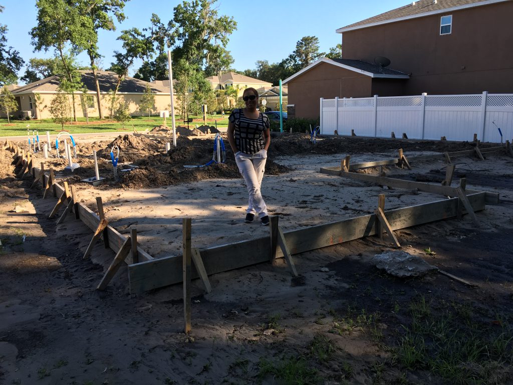 Cari standing where the master bedroom will be.