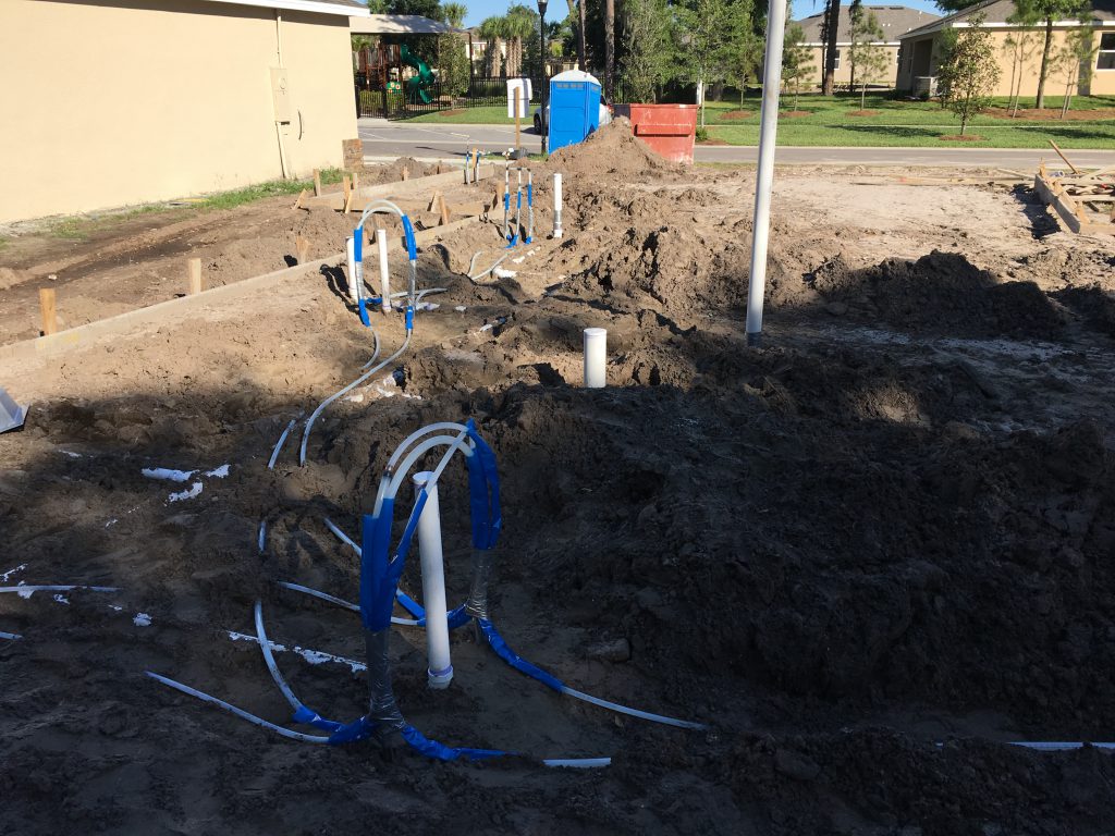 The plumbing for the master bathroom sinks (foreground), master bathroom shower and tub (midground), and guest bathroom and laundry room (background).