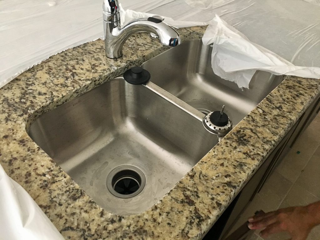 The kitchen sink in the island.